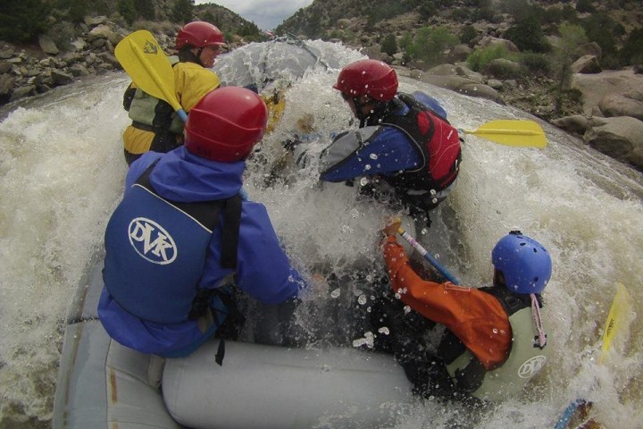 a person riding a snow board on a raft